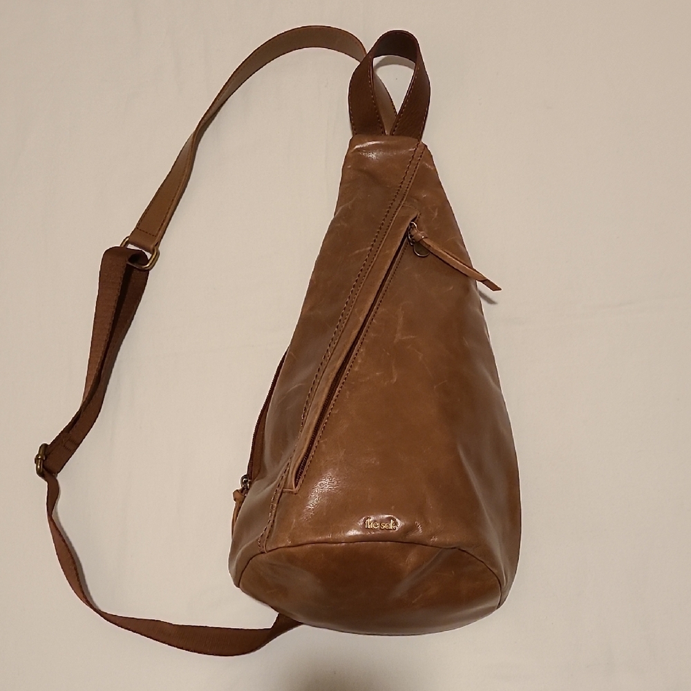 The Sak Brown Leather Sling Backpack